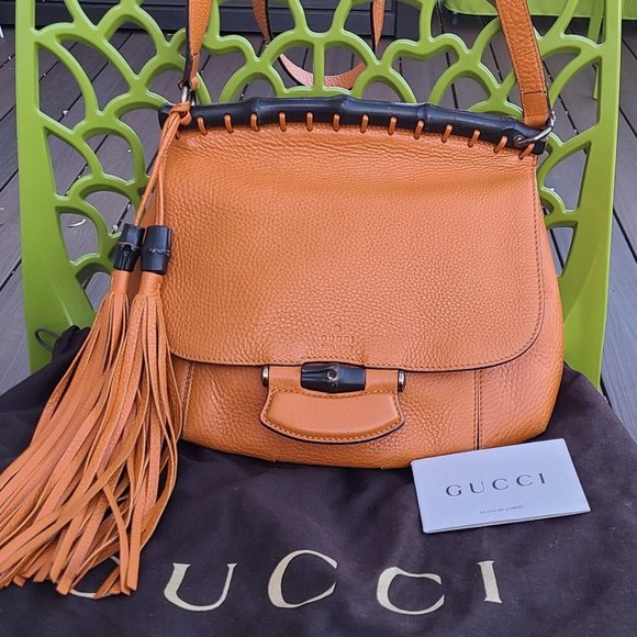 Gucci Handbags - Authentic Gucci leather orange tassel bamboo cross body bag 12"x10 Flap like new
